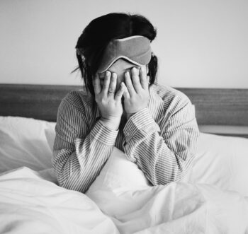 Groggy woman waking up.